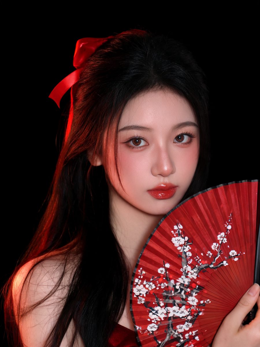Modern Douyin-style Chinese makeup with a red fan